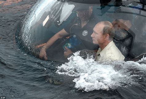 Vladimir putin and silvio berlusconi at president putin's valdai residence in russia. Vladimir Putin takes control of a research submarine in ...