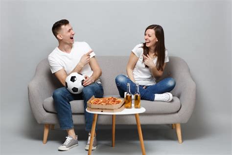 Laughing Couple Woman Man Football Fans Cheer Up Support Favorite Team With Soccer Ball Pointing