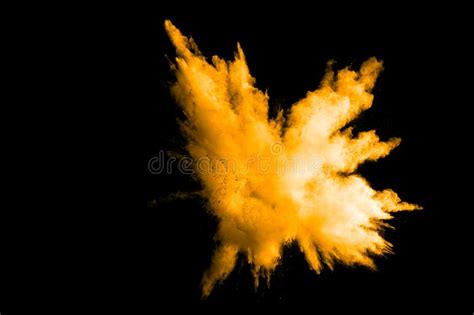 Deep Yellow Color Powder Explosion Cloud Isolated On Black Background