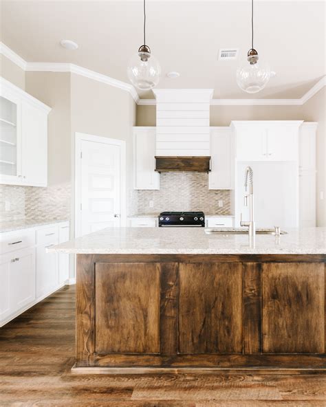 Modern White Rustic Kitchen With Dark Stained Island And Custom Shiplap