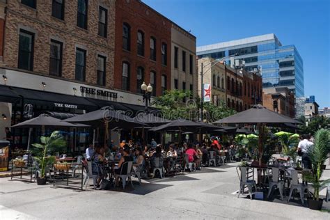 Outdoor Dining At Restaurants Along A Closed Off Street During The