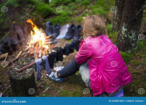 Back View Of Girl By Campfire In Forest Tourist Girl Sitting By The