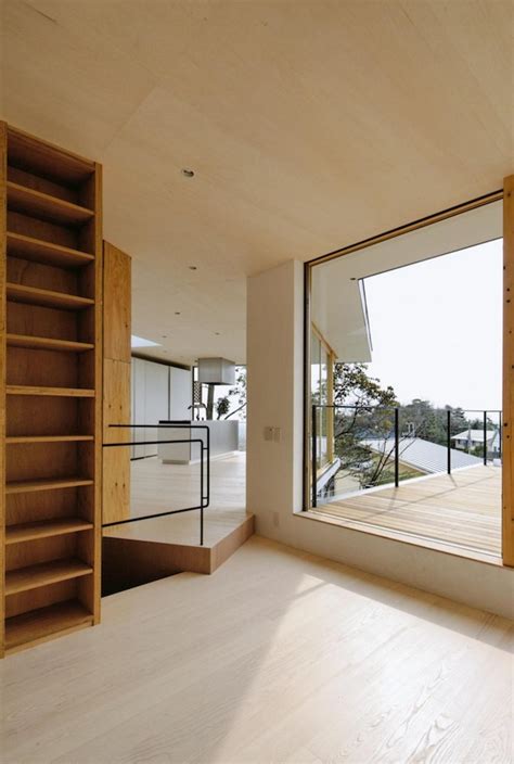 Steep site home terraced onto three levels. Steep Slope House With Bookshelf-Lined Interior | Modern ...