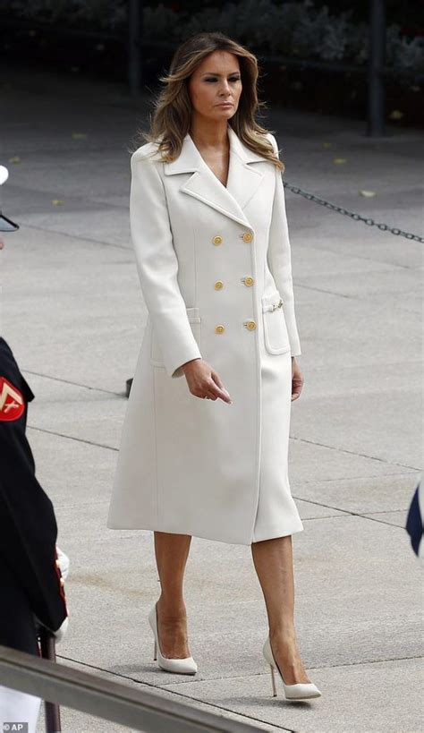 photos video melania trump dazzles in a white double breasted coat as she lay a wreath at the