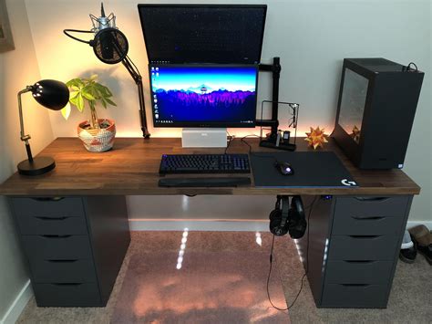 A Desk With A Computer Monitor Keyboard And Mouse