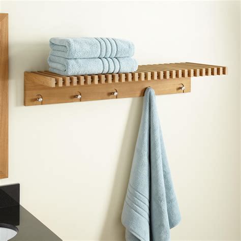 Many of our customers have written positive reviews about the hotel style chrome towel shelf and rack, pictured here. Hauck Teak Towel Shelf With Stainless Steel Hangers - Bathroom