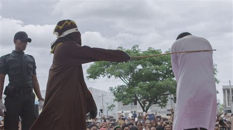 Gay Men Caned In Front Of Cheering Crowd In Aceh