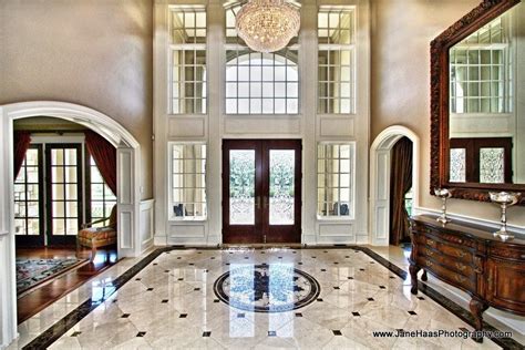 Traditional Entryway With Chandelier Chair Rail Complex Marble Floors