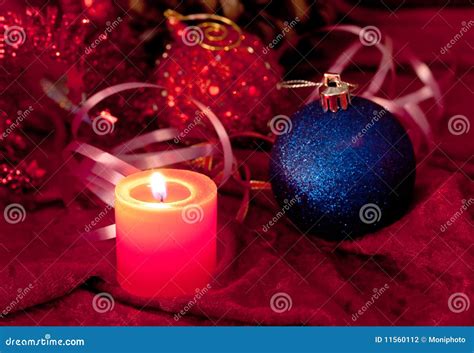 Christmas Candles And Baubles On Red Stock Photo Image Of Fire