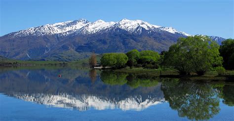 Summer view of lake wakatipu and the road from queenstown to glenorchy. New Zealand Accommodation | Natural Habitat Adventures