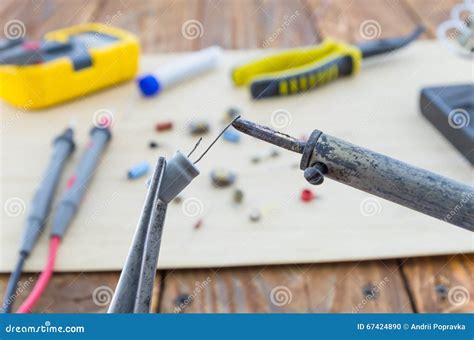 The Incandescent Soldering Iron And The Capacitor Stock Photo Image