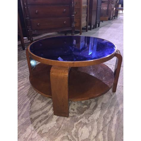 Supported by angled solid american walnut, rich brass details support the craftsmanship and beauty of real wood. Mid-Century Modern Blue Glass Coffee Table | Chairish