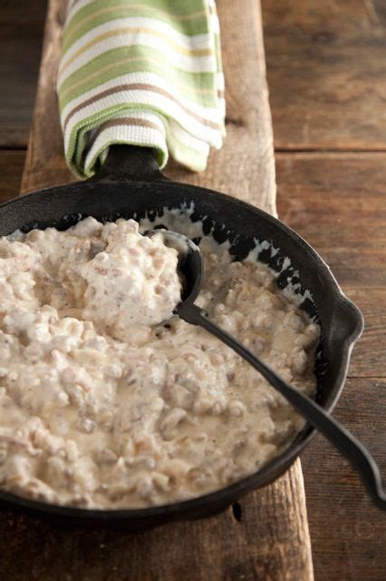 This country staple comes bulked up with pork #breakfastsausage and perfectly flaky, highrise biscuits! Paula Deen Sawmill Gravy - so bad for you, but sooooo ...