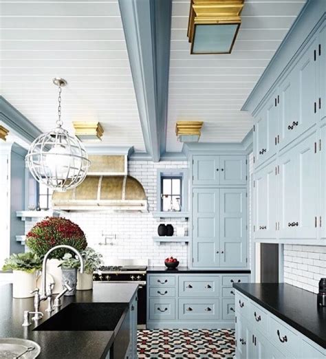 Minimalist black kitchen with modern cabinetry along with a black countertop and black appliances. Light blue cabinets with black counter | Kitchen design ...