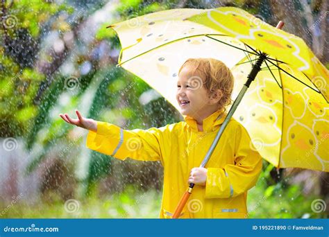Child Playing In The Rain Kid With Umbrella Stock Photo Image Of