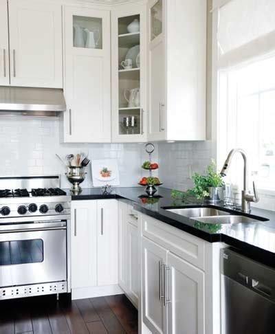 White cabinets brighten your kitchen and bring clean quality to any style. Black Countertops and White Cabinets - Traditional ...