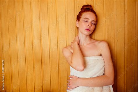 Redhaired Ginger Woman Relaxing In A Russian Banya Sauna Pampering