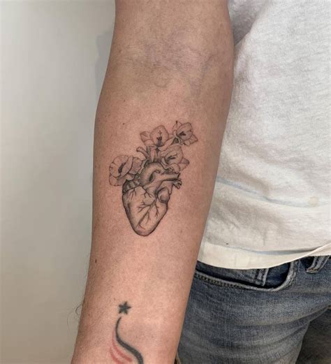 Anatomical Heart With Flowers Tattoo On The Inner