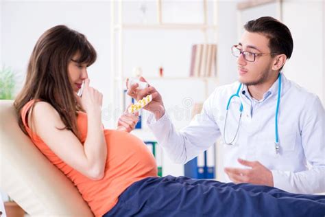 The Pregnant Woman With Her Husband Visiting The Doctor In Clinic Stock Image Image Of Health