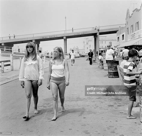 two blonde girls walk along the board walk at the santa monica beach news photo getty images