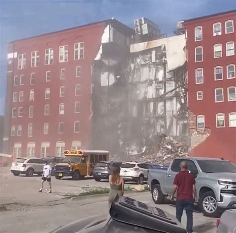massive portion of six story apartment building collapses in iowa as firefighters fanatically