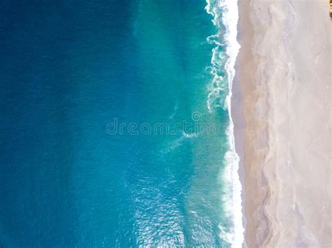 High Angle Shot Of The Ocean Waves Meeting The Shore Stock Image