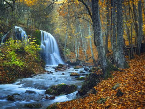 Beautiful Waterfall In Autumn Forest In Crimean Mountains At Sun Stock