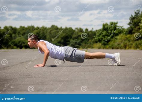 A 19 Year Old Teenage Boy Doing Push Ups A Public Park Stock Photo