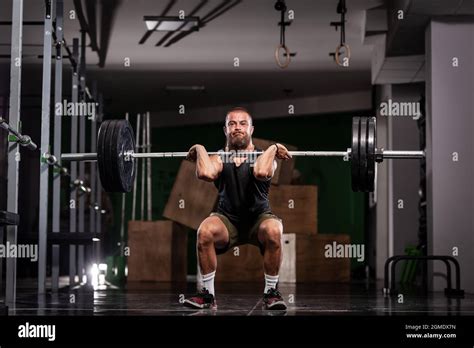 Muscular Athlete Lifting Very Heavy Barbell Stock Photo Alamy