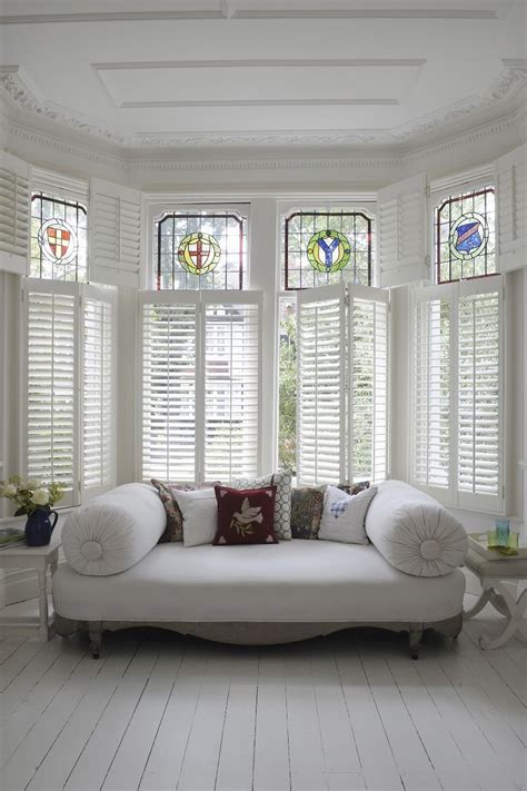 Utilize the home depot's installation services to ensure a proper install. Simple, white living room look with large bay window ...