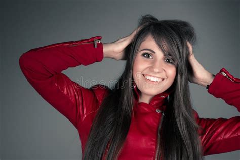 Beautiful Young Brunette Woman Wearing Red Leather Jacket Stock Photo