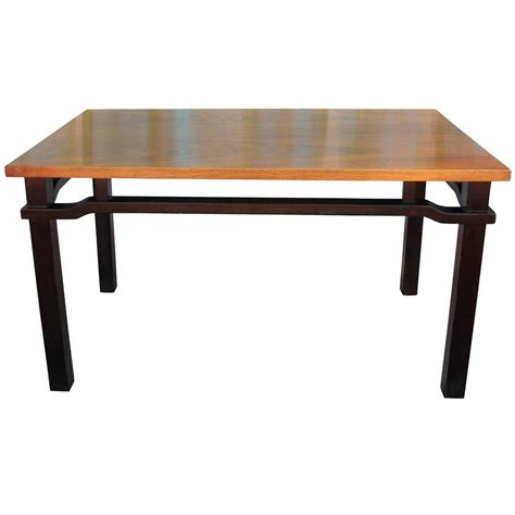 A coffee table like this, for example, is perfect for lending your home a modern look: Elegant Two Tone Walnut Coffee Table For Sale at 1stdibs