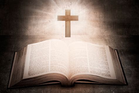 Open Holy Bible With Wooden Cross In The Middle Stock Photo Download