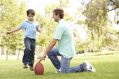 Father And Son Playing American Football Together — Stock Photo