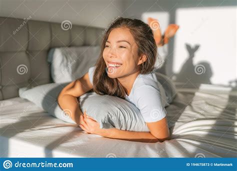 Bed Woman Waking Up Early Morning Happy Enjoying Sun On Comfortable