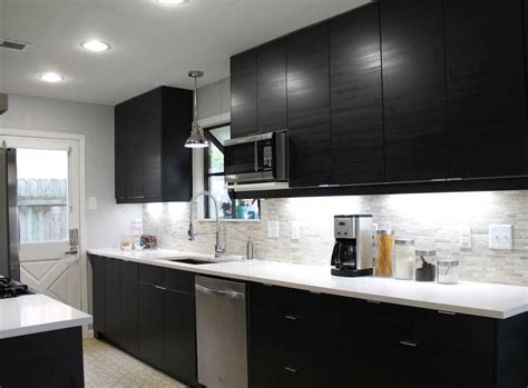 Dark wood cabinetry and island match with same material dark. White Quartz Countertops with Black Cabinets - StoneADD Photo
