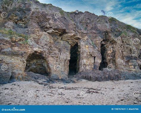 Caves In Eroded Mudstone Cliffs At Runswick Bay In North Yorkshire Uk