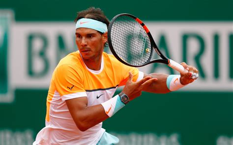 The one and all time champion of roland garros ? Tennis player Rafael Nadal with a racket on the court ...