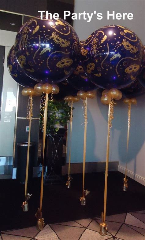Entry into store, luxe curtains. Giant 3 Foot Balloons for a Masquerade themed corporate ...