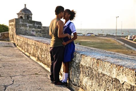 Traveling Photographer Captures Couples Kissing In Public Around The World