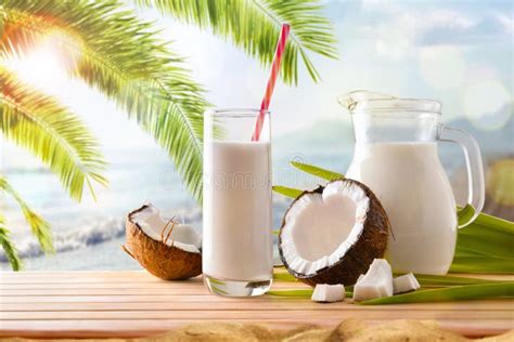 Coconut Milk In Containers And Fruit On The Beach Stock Image Image