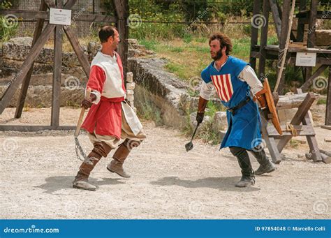 Actors Doing A Theatrical Staging As Medieval Fighters In The Castle Of