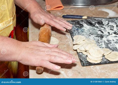 Hand Holds A Wooden Rolling Pin Soiled In Flour Stock Image Image Of