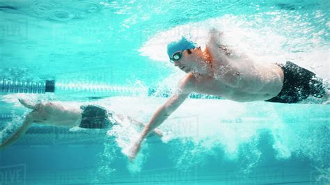 Swimmers Racing In Pool Stock Photo Dissolve