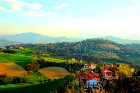 Scenic View Of Greenery Landscape And Hills And Blue Sky Stock Photo