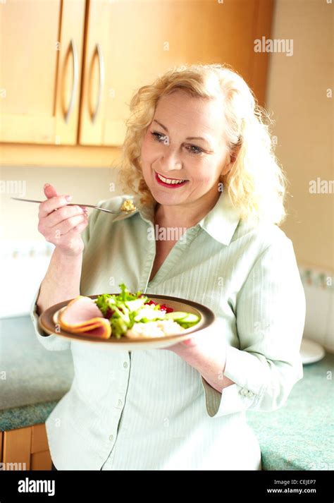 Woman Eating A Salad Stock Photo Alamy
