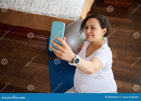 Close Up Pregnant Woman Makes Selfie Relaxes After Stretching