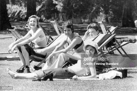 A Girl Sunbathing In A Park Photos And Premium High Res Pictures Getty Images