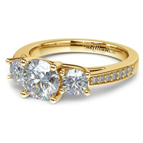 All three stones can be the same shape or different shapes. Three Stone Trellis Diamond Engagement Ring in Yellow Gold