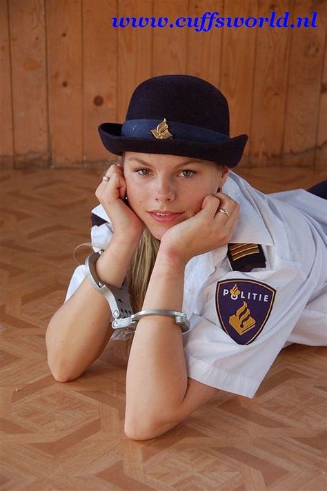 Woman In A Dutch Police Uniform Poses With Dutch Lips Handcuffs